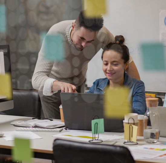 An image of two people working in an office